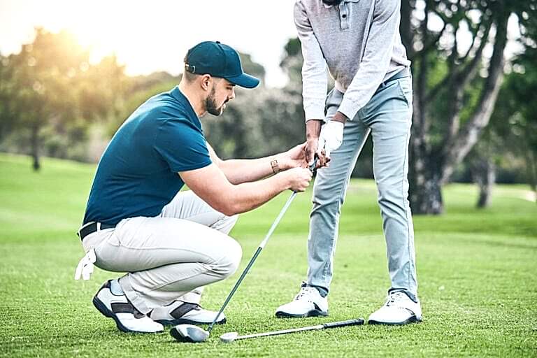 Golf lesson, teaching and sports coach help man with swing, putt and stroke outdoor. Lens flare, green course and club support of a athlete ready for exercise, fitness and training for a game.